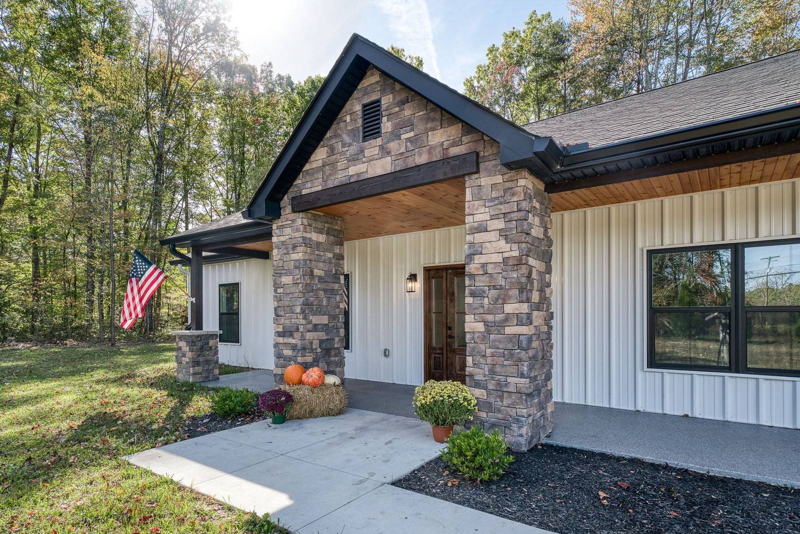 Stone-column covered entry porch on a TruBuild custom home