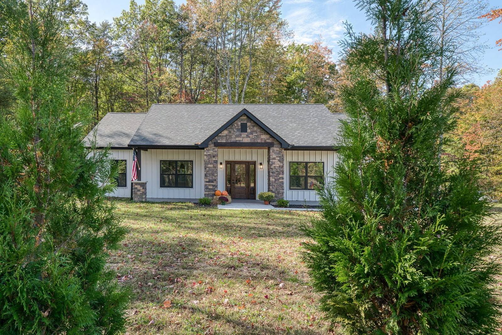 Completed custom home set among mature trees